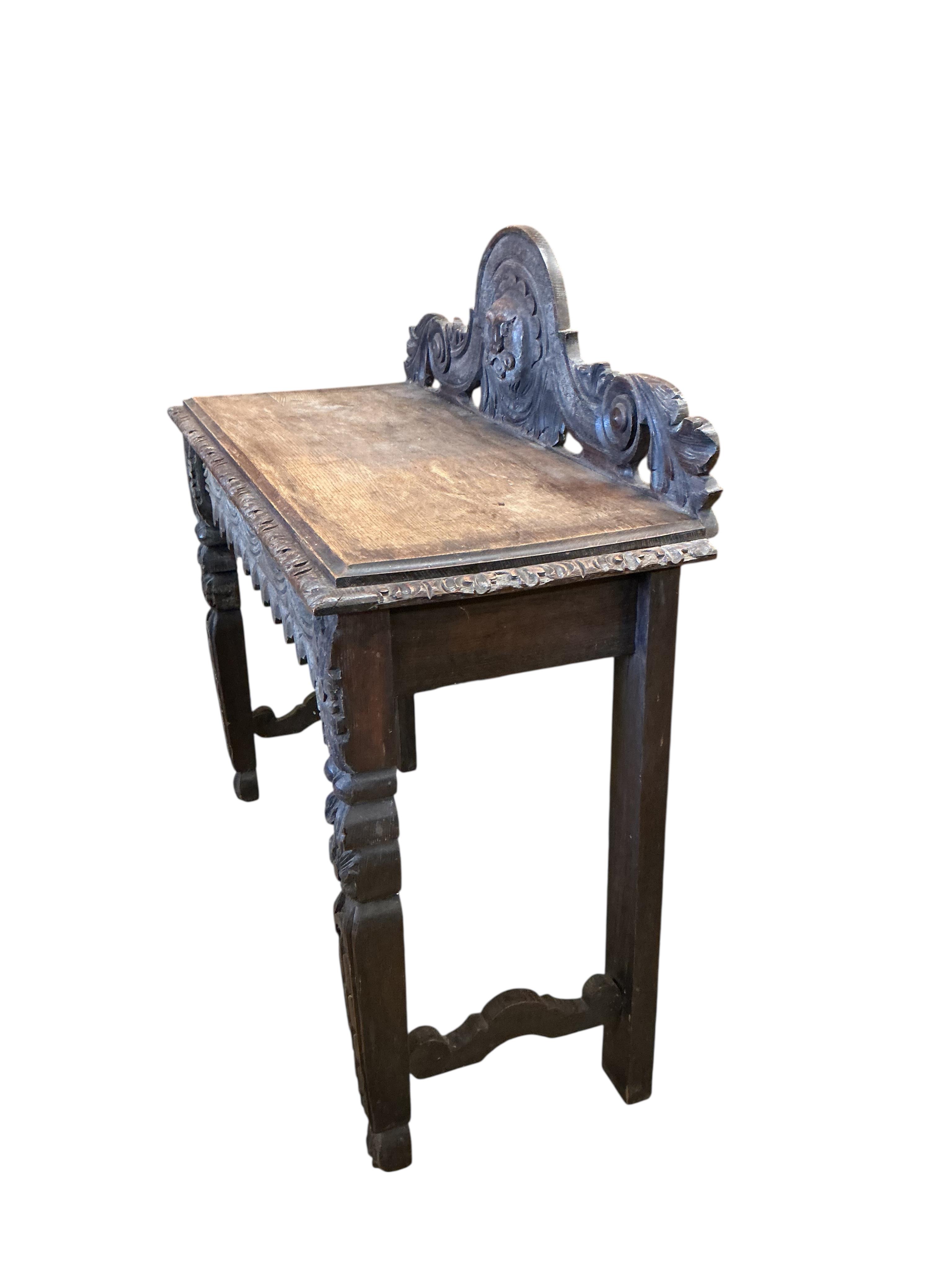 A Victorian carved oak hall table, width 103cm, depth 44cm, height 104cm